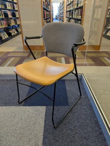 Green/black/gray speckled back with brown seat and black arms task chair metal sled base