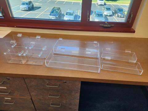 4 brochure holders, 2 large basket style acrylic holders, and 2 smaller basket style holders.