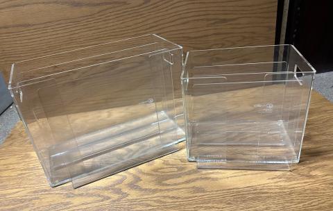 two acrylic periodical display boxes