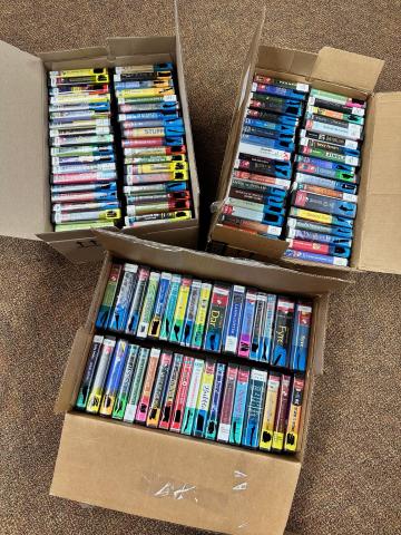three boxes of audiobooks on CD