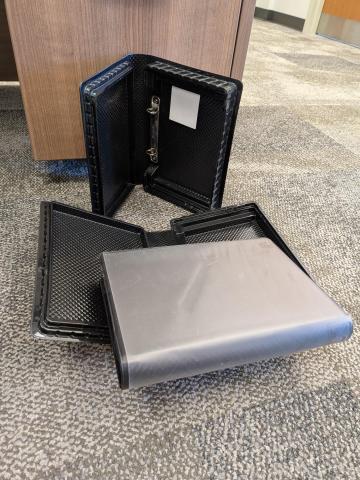 3 black plastic cases