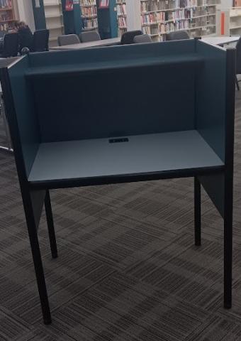 Study carrel with teal colored casing and gray top