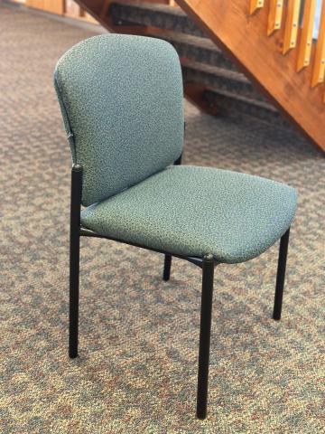 Blue/green padded back/seat chair with black steel legs