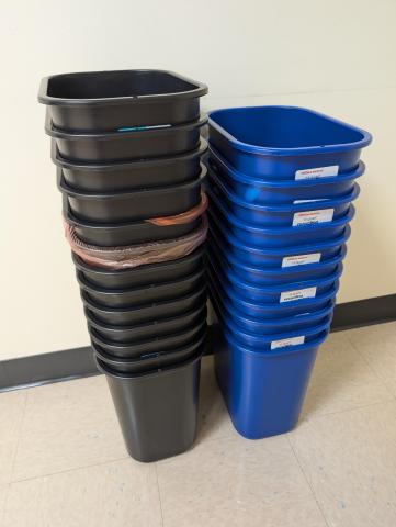 garbage cans stacked photo