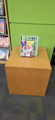 brown cube with books on it