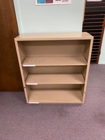 beige metal shelving - three shelves