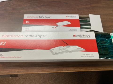 two boxes of bibliotecha Tattle-Tape