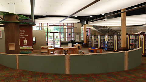 An open children's area of a library with words on a wall that read Aletha Hunt Storybook Forest.