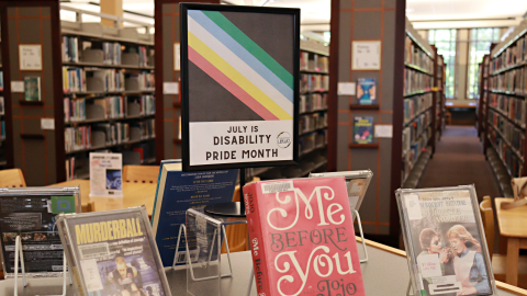 A book display that reads July is pride disability month. 