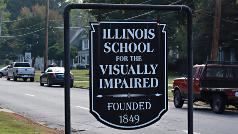 An outdoor sign that reads Illinois School for the Visually Impaired, founded 1849. 