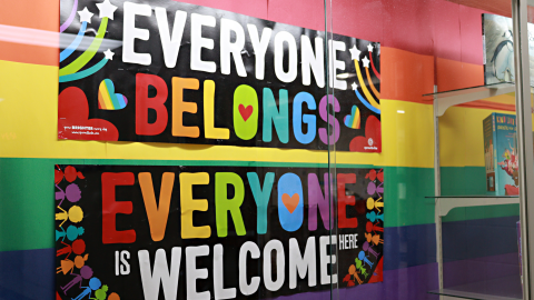 A rainbow sign that reads “everyone belongs, everyone is welcome here.” 