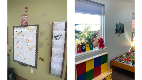 The children's play area featuring (left to right) a red, yellow, blue, and green, upright lego board, a train table, and a wooden play table. There's a window above the lego board, and on the window sill is a sign made of red, blue, yellow, and green crayons with black letters that spell, "read." Next to the sign is a plush Clifford the Dog.  