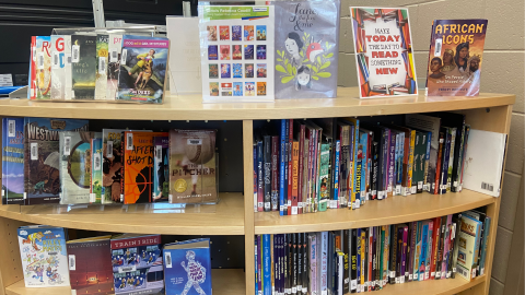 A book display on a library bookcase showcasing the 2025 Rebecca Caudill  Young Readers' Book Award nominees.