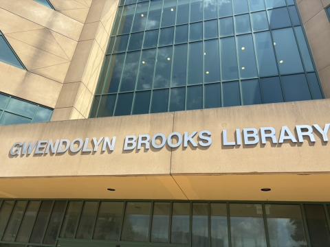 Metal letters spell out Gwendolyn Brooks Library on the building's exterior over the main door. 
