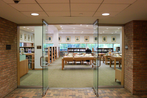 Glass doors open at the entrance of the Chicago Botanic Garden library. 