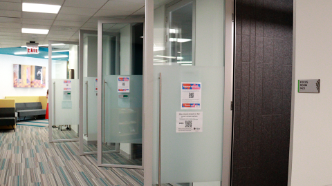Four open doors leading to small spaces labeled Focus Rooms. 